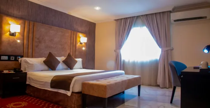Guest room with seating at Amber Residence