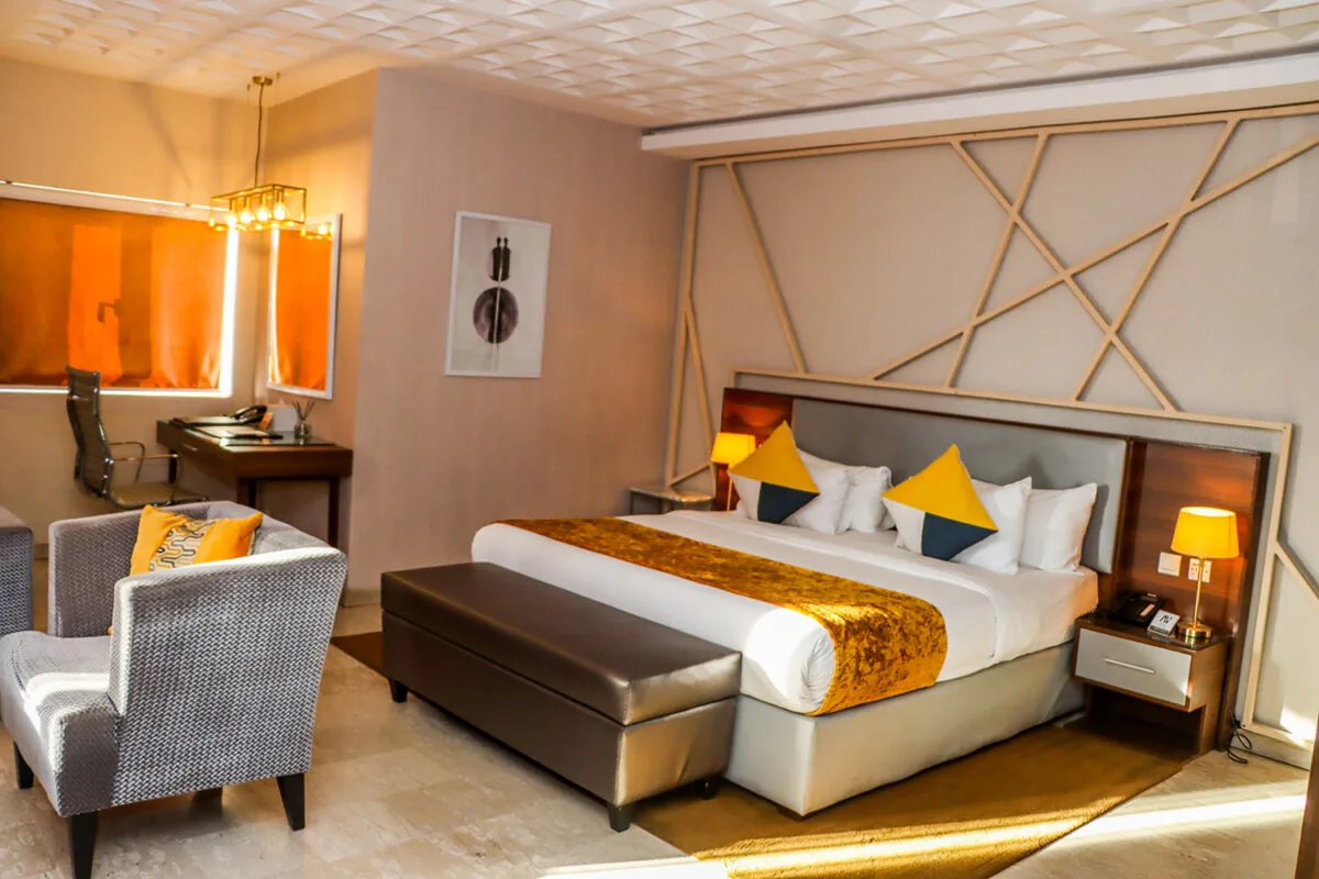 Guest room with seating at Angle Villa Hotel
