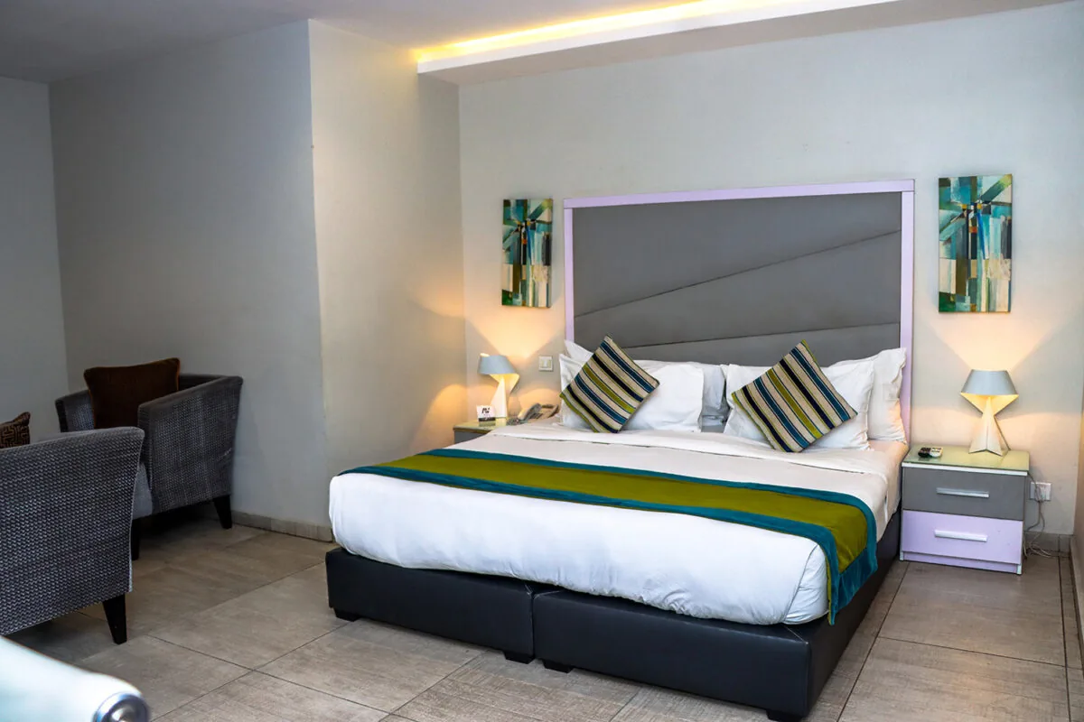 Guest room and armchair at Angle Villa Hotel